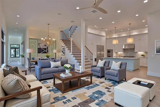 a living room with fireplace furniture and a flat screen tv