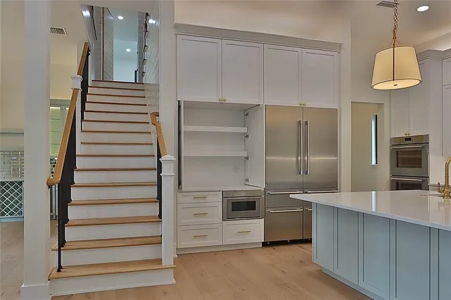 a hallway with cabinets