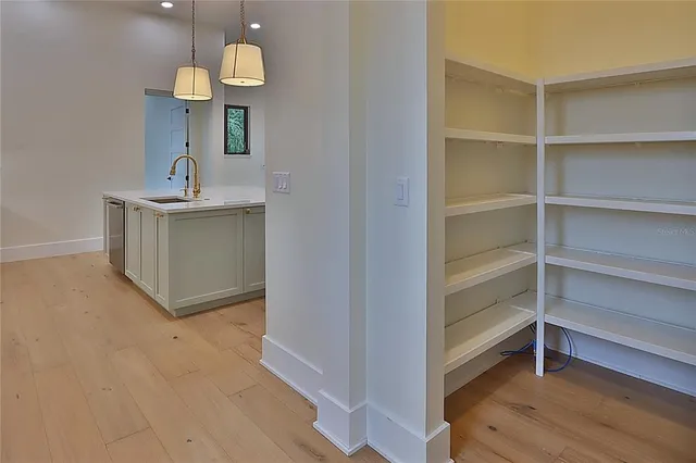 a kitchen with a stove a sink and a microwave