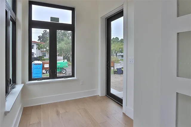 a bathroom with a toilet sink vanity and mirror