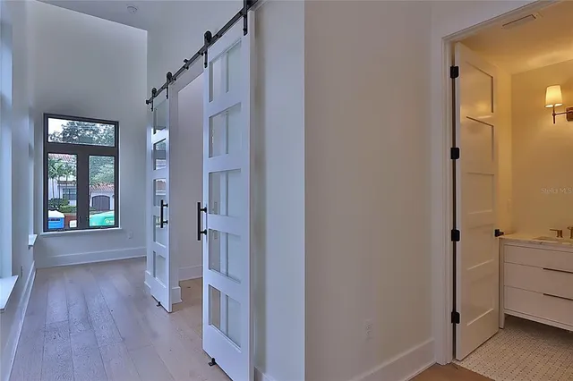 a kitchen with a sink stainless steel appliances and cabinets