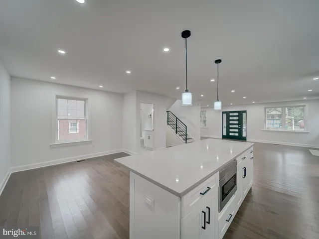 a bathroom with a double vanity sink a toilet and a shower