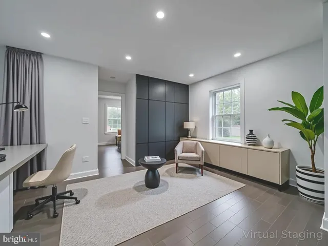 a bedroom with two beds and a window