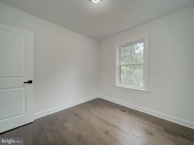a bathroom with a sink toilet and a mirror