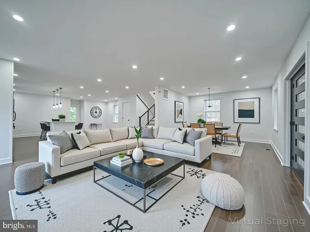 wooden floor fireplace and windows in an empty room