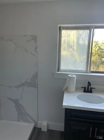 a bathroom with a sink and a bathtub