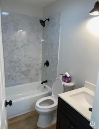 a bathroom with a sink toilet and mirror