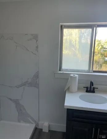 a bathroom with a shower and a toilet