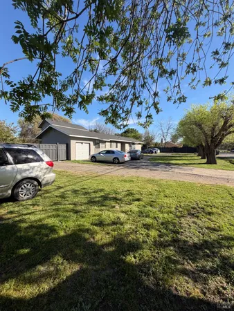 a view of a house with a big yard