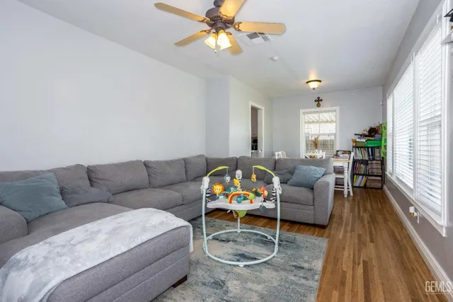 a living room with furniture and a rug