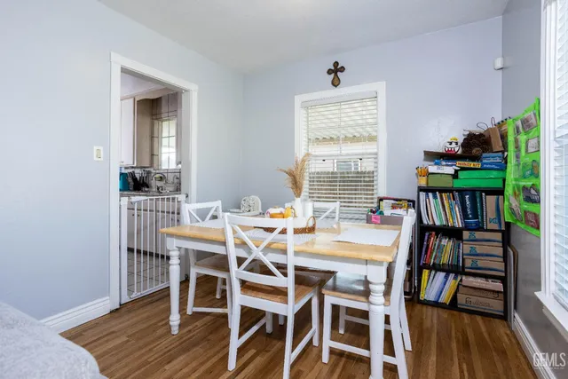 a view of a dining room with furniture window and wooden floor