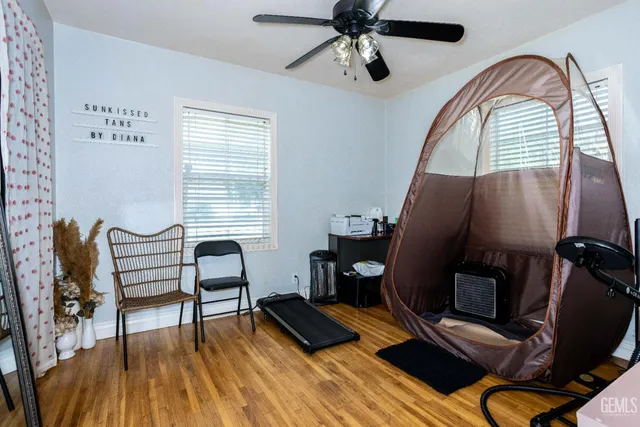 a view of a livingroom with furniture and a workspace