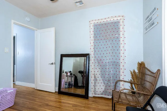 a view of a livingroom with furniture and wooden floor