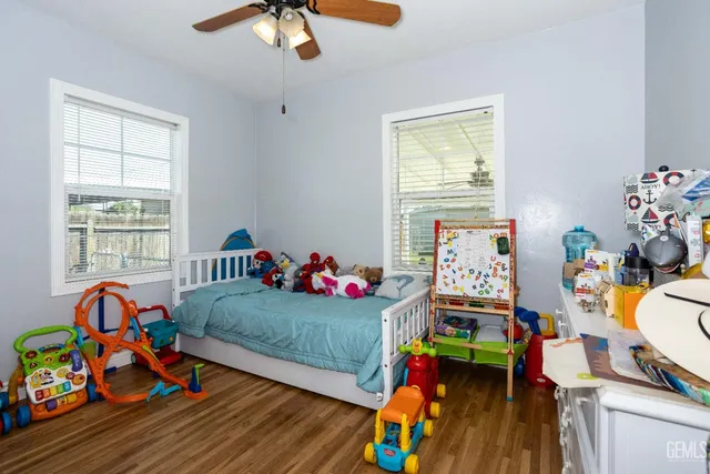 a living room filled with furniture and a window