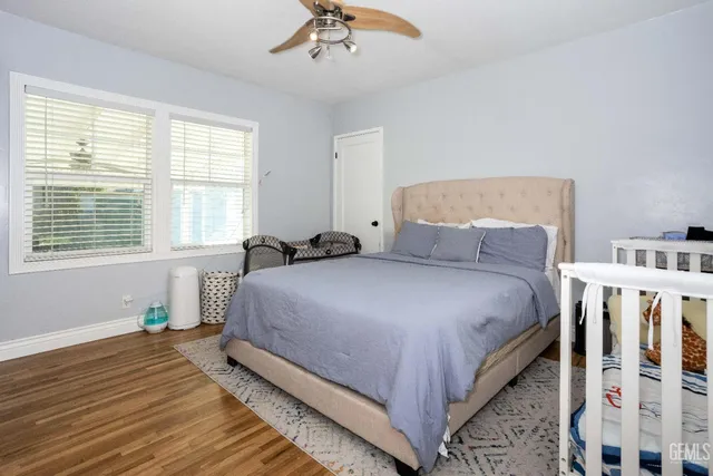 a bedroom with bed and a window