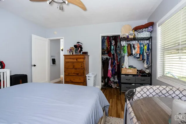 a bedroom with a bed and a closet