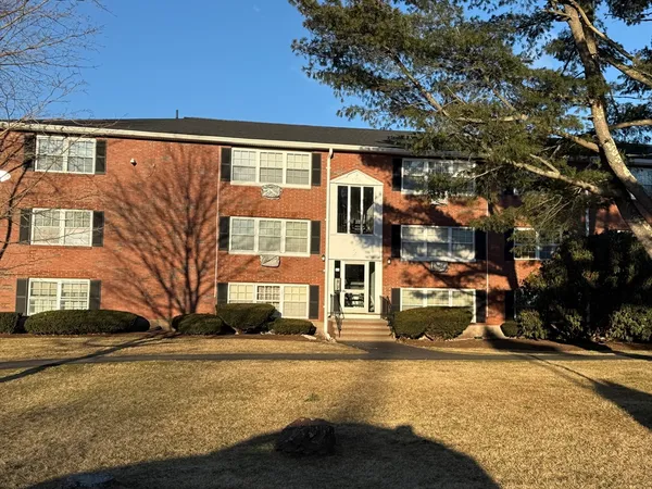 a front view of a building with street view