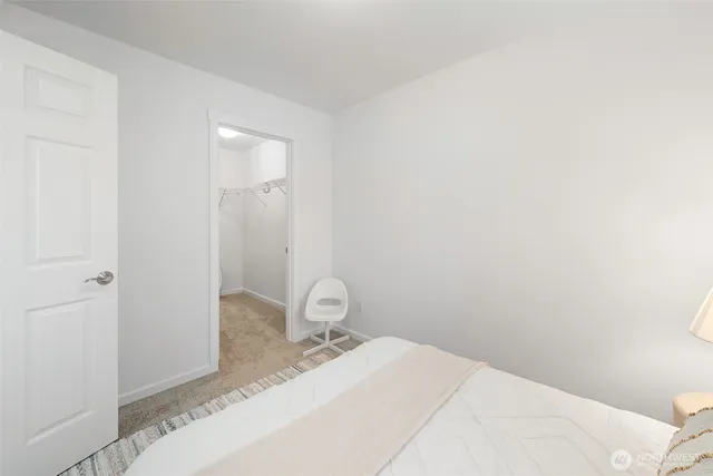 a bathroom with a granite countertop toilet and a sink