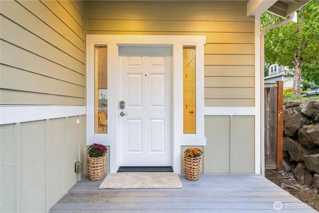 a view of door with wooden floor and seating space