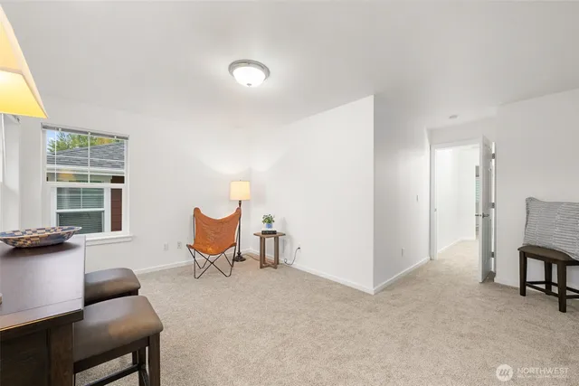 a living room with furniture a window and a table