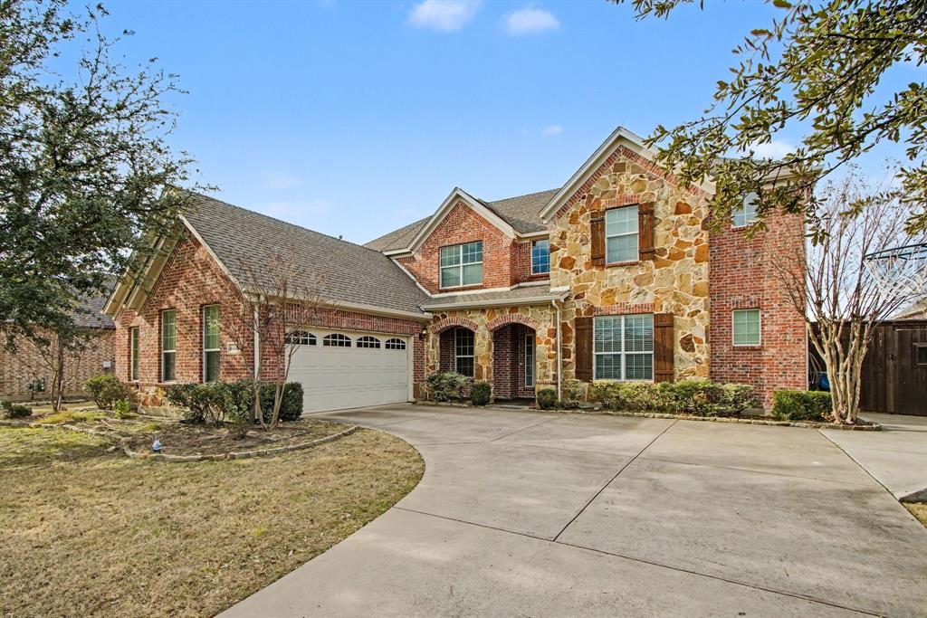 6131 Myrtle Lane Frisco, TX 75036 - Photo 2 of 34 a front view of a house with a yard