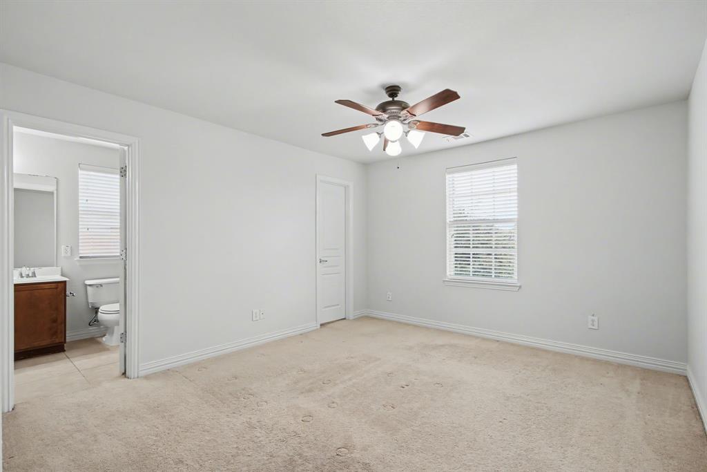 6131 Myrtle Lane Frisco, TX 75036 - Photo 24 of 34 an empty room with chandelier fan and windows