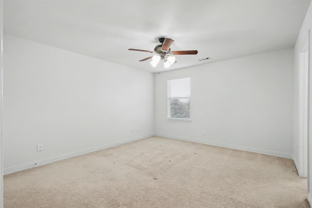 6131 Myrtle Lane Frisco, TX 75036 - Photo 25 of 34 an empty room with windows and fan