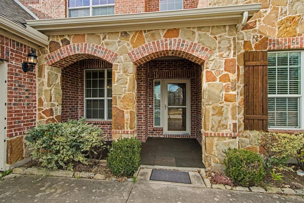 6131 Myrtle Lane Frisco, TX 75036 - Photo 3 of 34 a front view of a house with a garage