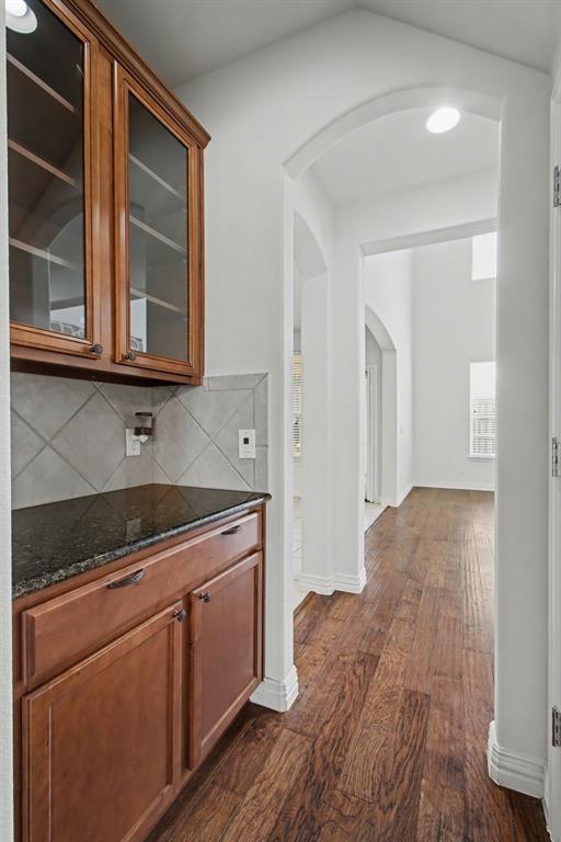 6131 Myrtle Lane Frisco, TX 75036 - Photo 7 of 34 a kitchen with stainless steel appliances granite countertop a stove and a sink