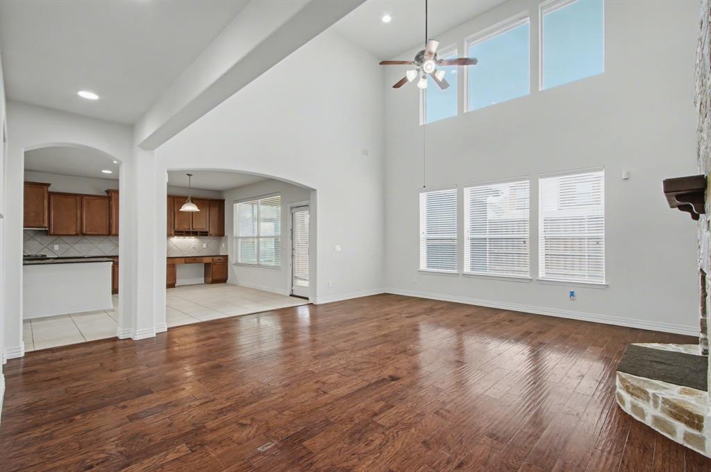 6131 Myrtle Lane Frisco, TX 75036 - Photo 8 of 34 a view of an empty room with wooden floor and a window