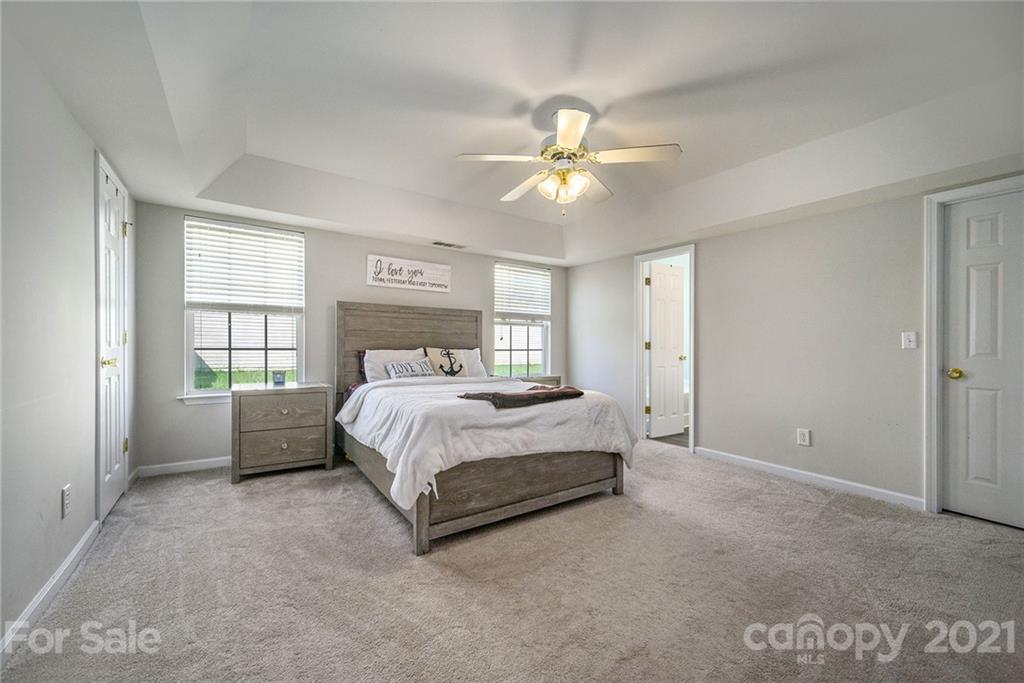 2778 Rustic Ridge Court Rock Hill, SC 29730 - Photo 20 of 34 a spacious bedroom with a bed and a window