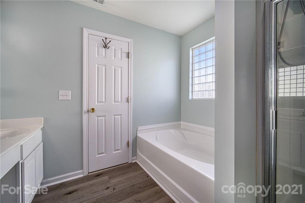 2778 Rustic Ridge Court Rock Hill, SC 29730 - Photo 23 of 34 a white bath tub sitting next to a bathroom