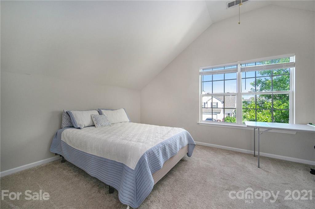 2778 Rustic Ridge Court Rock Hill, SC 29730 - Photo 26 of 34 a large bed sitting in a bedroom next to a window