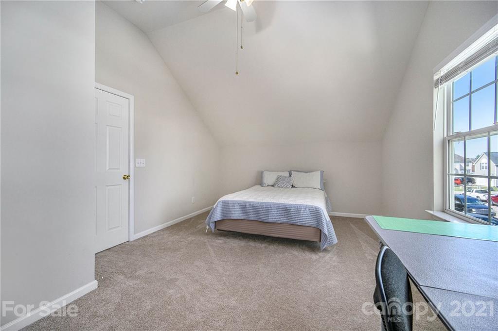 2778 Rustic Ridge Court Rock Hill, SC 29730 - Photo 27 of 34 a bedroom with a bed and a table in it