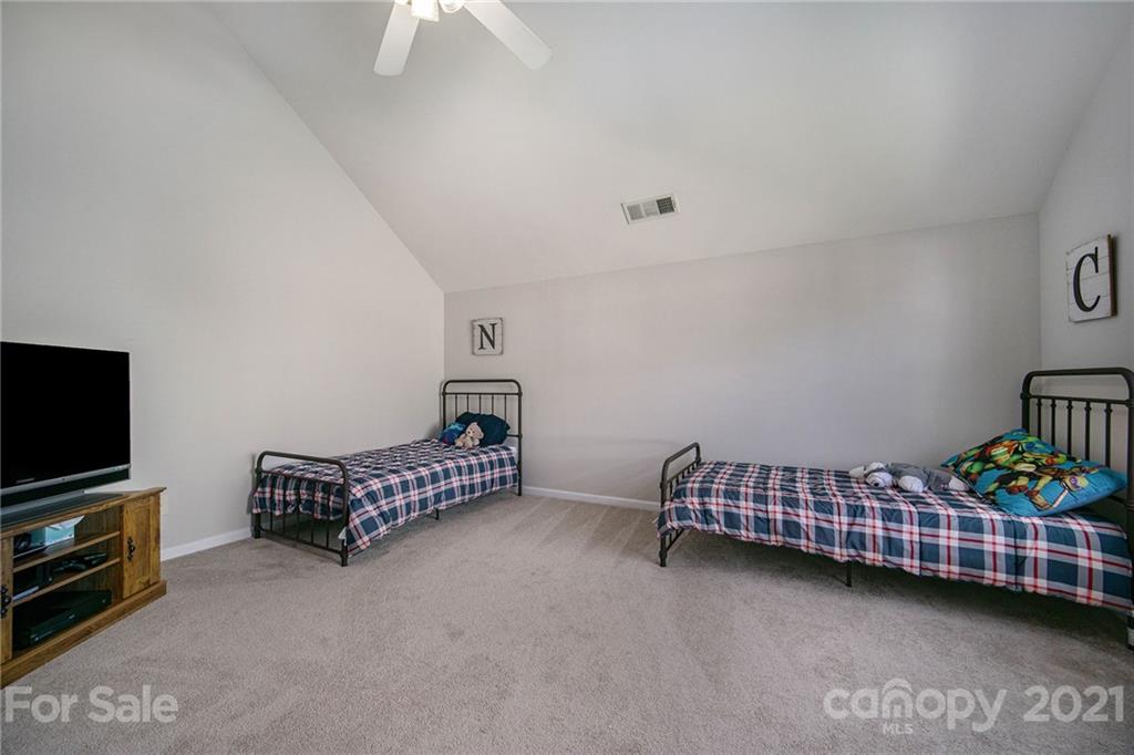 2778 Rustic Ridge Court Rock Hill, SC 29730 - Photo 28 of 34 a bedroom with furniture and a flat screen tv