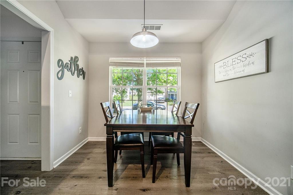 2778 Rustic Ridge Court Rock Hill, SC 29730 - Photo 6 of 34 a dining room with furniture a rug and a chandelier