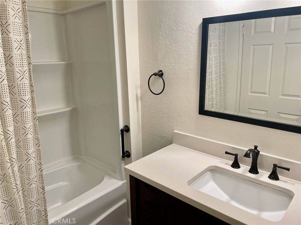 10920 Moorpark Street North Hollywood, CA 91602 - Photo 14 of 15 a bathroom with a sink and a bathtub