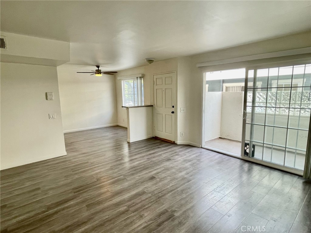 10920 Moorpark Street North Hollywood, CA 91602 - Photo 3 of 15 an empty room with wooden floor and windows