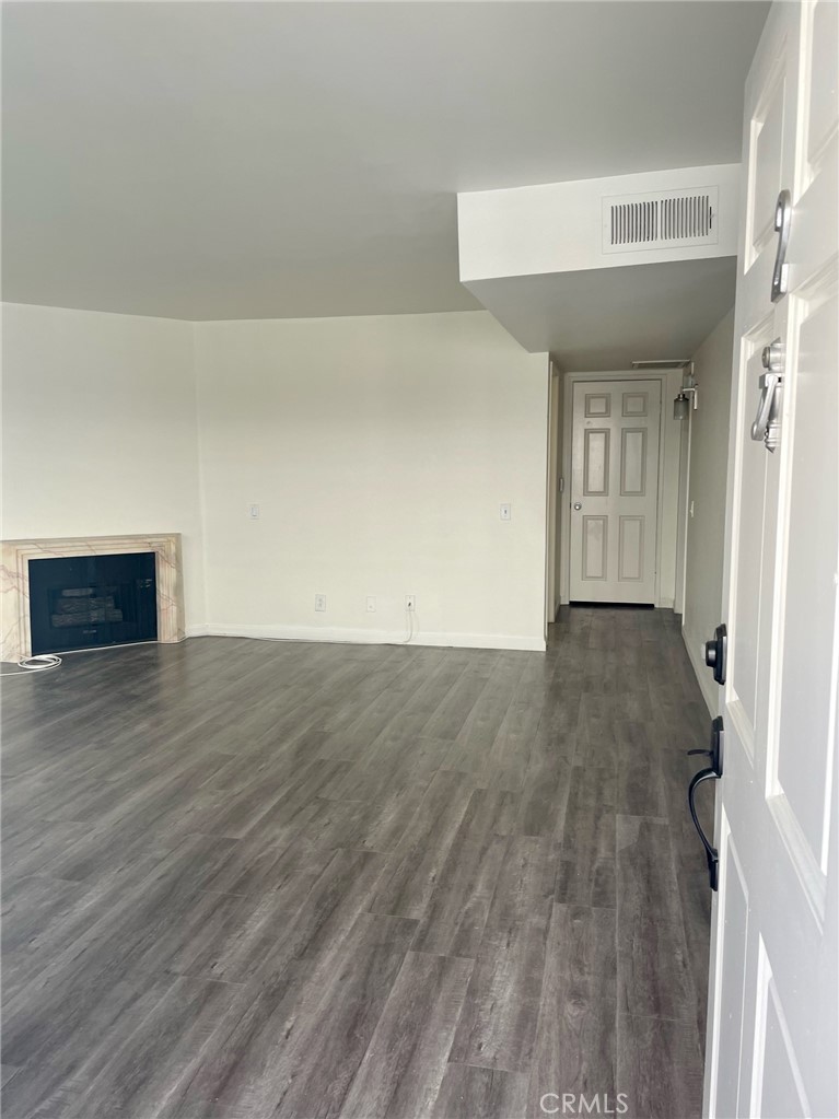 10920 Moorpark Street North Hollywood, CA 91602 - Photo 4 of 15 a view of empty room with wooden floor and fan