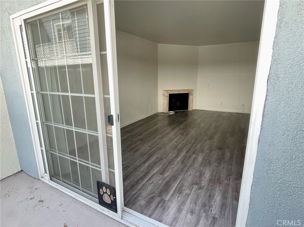 10920 Moorpark Street North Hollywood, CA 91602 - Photo 6 of 15 a view of a livingroom with wooden floor and fireplace