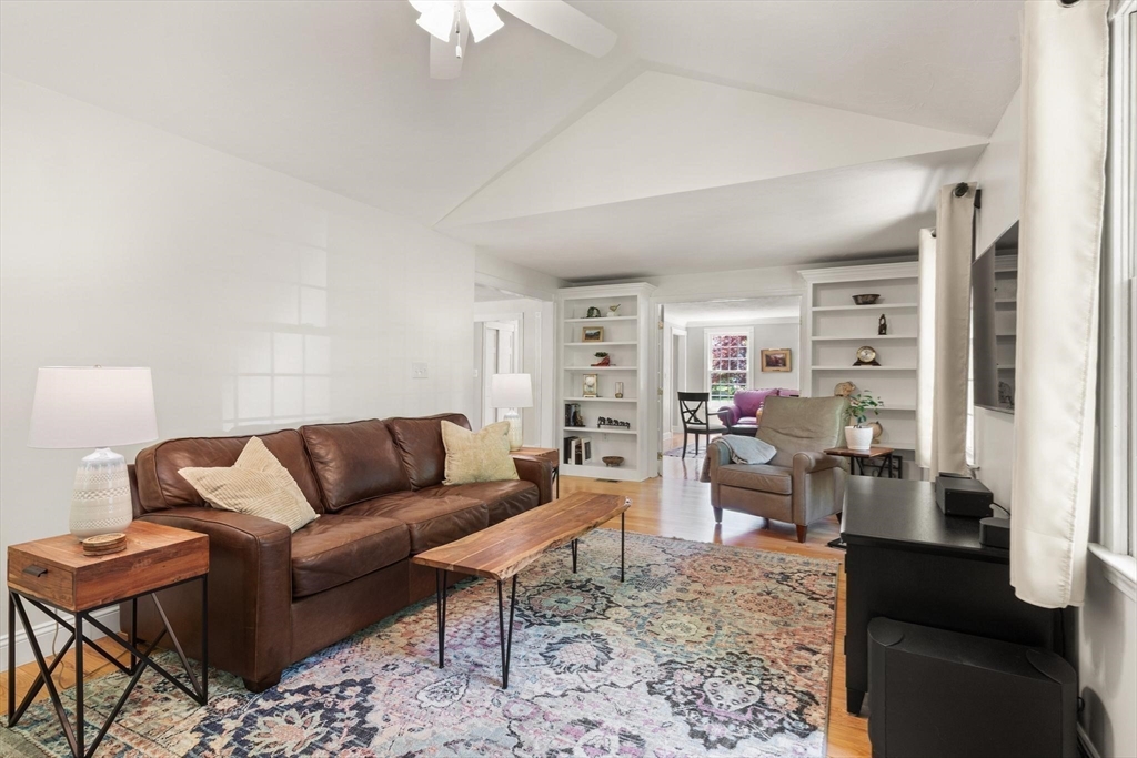 67 Bridle Path Franklin, MA 02038 - Photo 11 of 35 a living room with furniture wooden floor and a large window