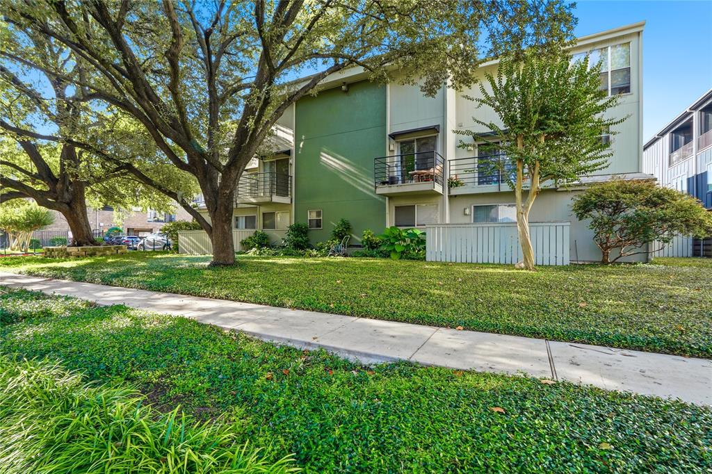 4211 Holland Avenue, Unit 105 Dallas, TX 75219 - Photo 21 of 26 a view of a house with a big yard and large trees