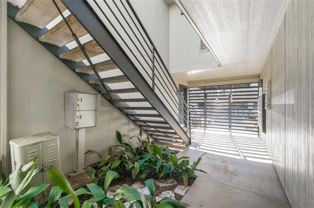 4211 Holland Avenue, Unit 105 Dallas, TX 75219 - Photo 25 of 26 a view of stairs and potted plants