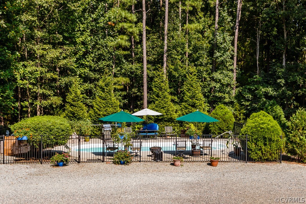 16045 Old Ridge Road Montpelier, VA 23192 - Photo 31 of 45 an outdoor space with patio and white umbrellas