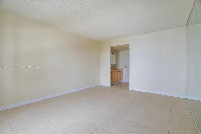 a view of an empty room and fire place