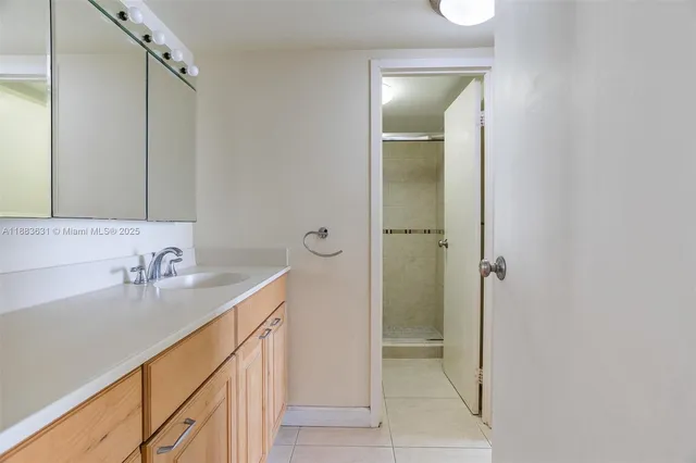 a bathroom with a double vanity sink and mirror