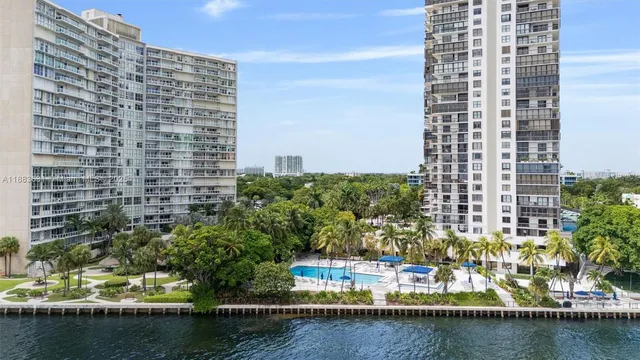 a view of balcony with outdoor space and tall buildings