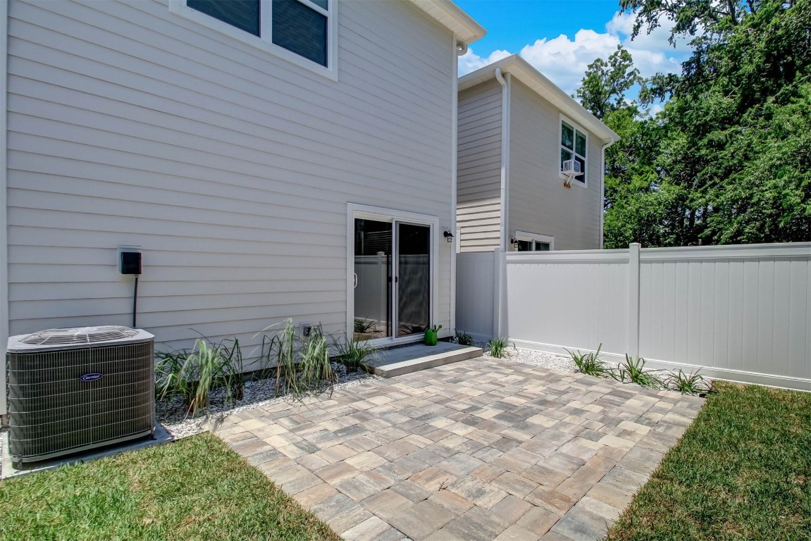 926 South 7th Street Fernandina Beach, FL 32034 - Photo 35 of 37 a backyard of a house with garage and door