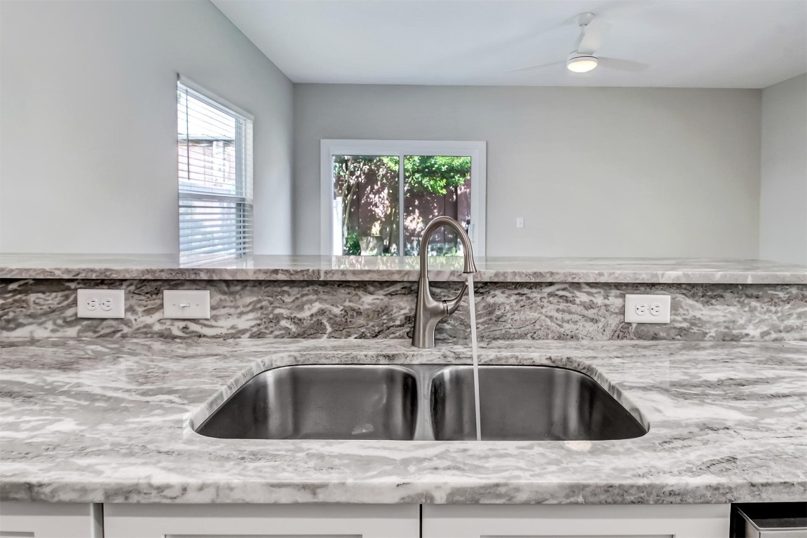 926 South 7th Street Fernandina Beach, FL 32034 - Photo 8 of 37 a kitchen with a sink and a window