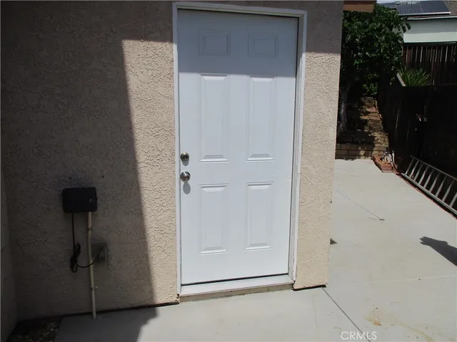 a view of kitchen with granite countertop cabinets and wooden floor